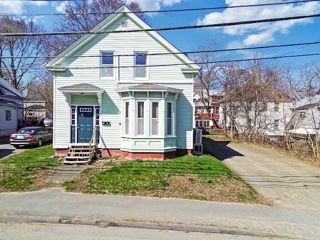 view of front of home featuring aphalt driveway and entry steps