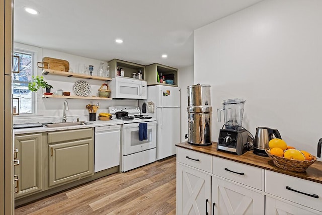 kitchen featuring open shelves, a sink, white appliances, wooden counters, and light wood-type flooring