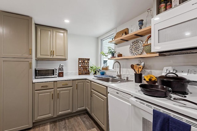 kitchen with open shelves, white appliances, light countertops, a sink, and gray cabinetry