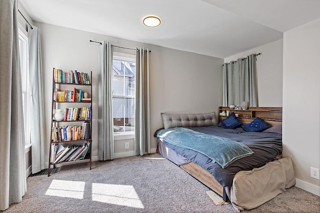 carpeted bedroom with baseboards