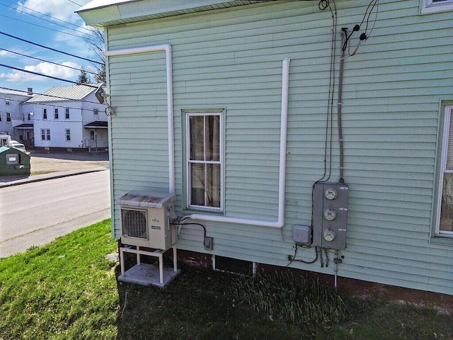 view of side of property with ac unit