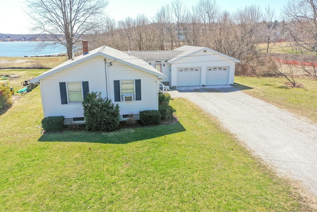 view of front of house featuring a chimney, a front yard, dirt driveway, cooling unit, and a water view