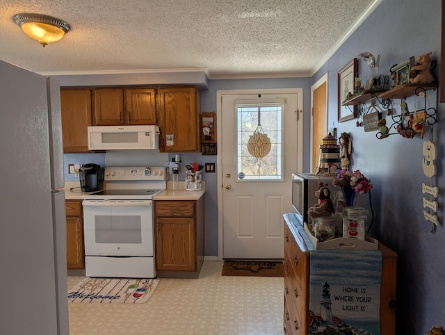 kitchen with crown molding, brown cabinets, white appliances, and light countertops