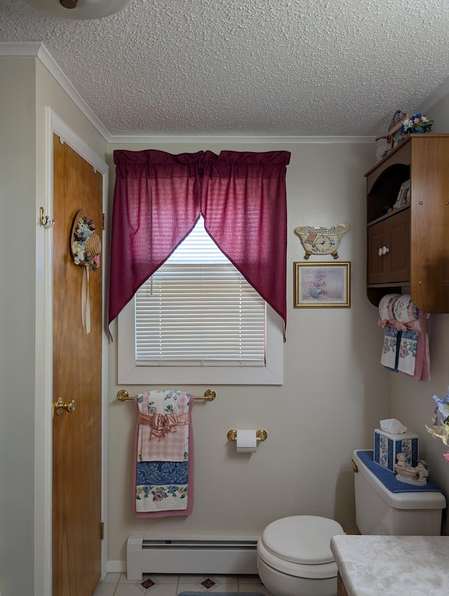 bathroom with crown molding, toilet, a textured ceiling, and baseboard heating