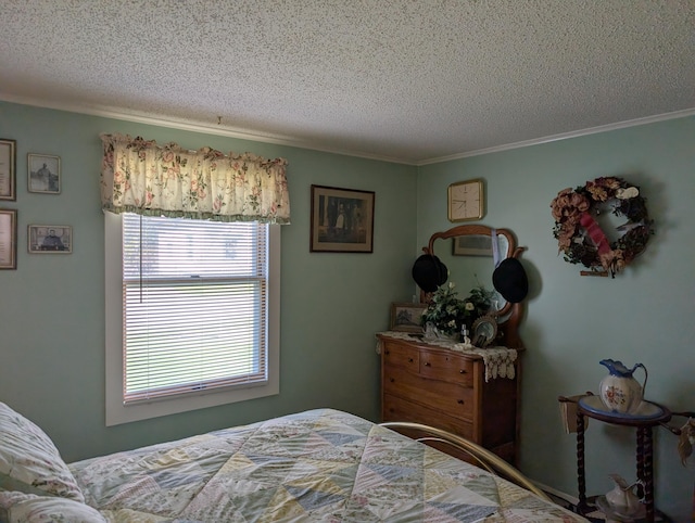 bedroom featuring a textured ceiling and ornamental molding