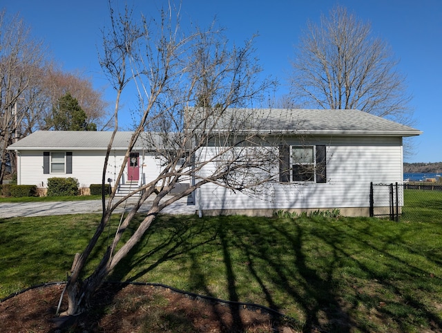 single story home with fence and a front yard