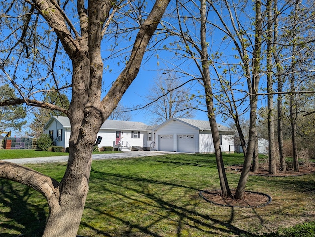 ranch-style home with concrete driveway, an attached garage, and a front lawn