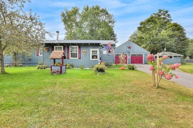 ranch-style house with a detached garage and a front yard