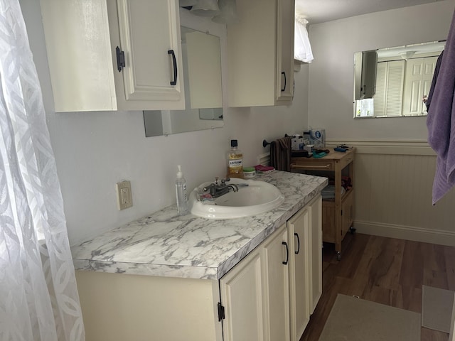 bathroom featuring vanity and wood finished floors