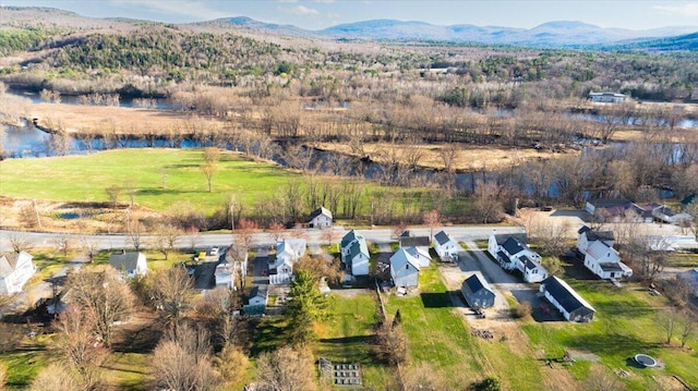84 Main St, Dixfield, ME 04224 - drone / aerial view with a residential view and a water and mountain view