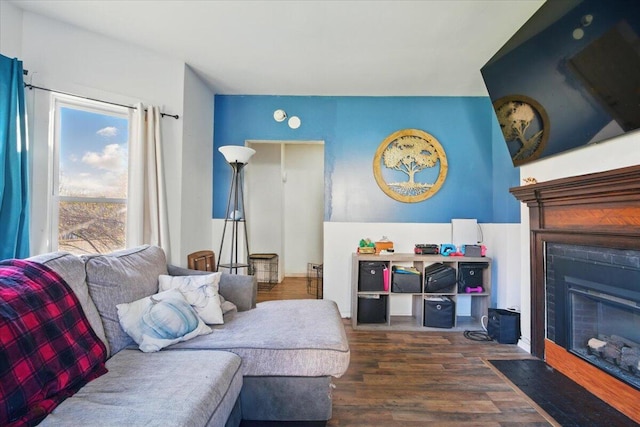 84 Main St, Dixfield, ME 04224 - living area featuring a fireplace with flush hearth and wood finished floors