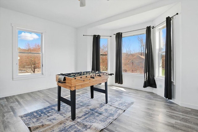 84 Main St, Dixfield, ME 04224 - game room featuring baseboards, a wealth of natural light, and wood finished floors