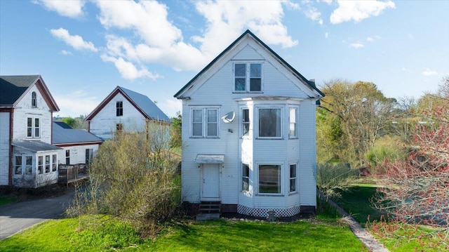 84 Main St, Dixfield, ME 04224 - victorian house with a front yard and entry steps