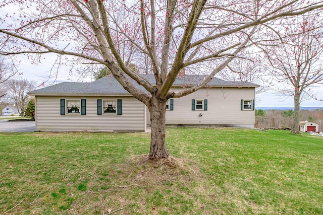 back of house featuring a yard