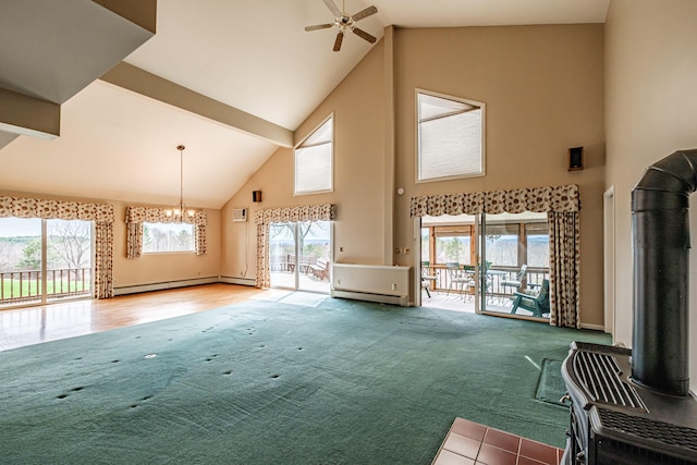 unfurnished living room featuring high vaulted ceiling, carpet, ceiling fan with notable chandelier, beamed ceiling, and a baseboard heating unit