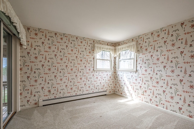 carpeted empty room with baseboard heating and wallpapered walls