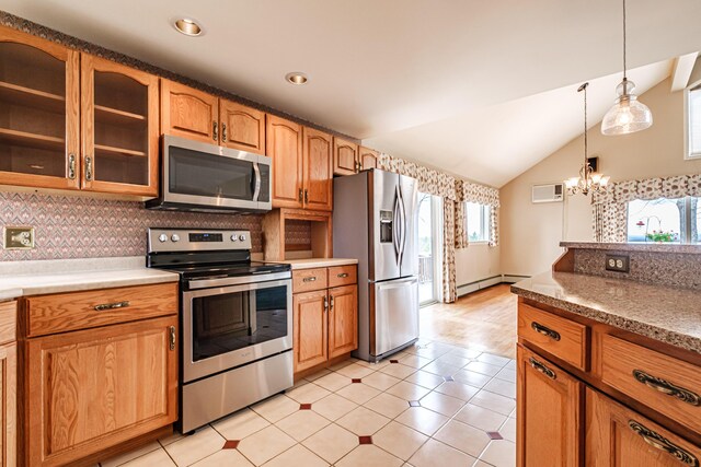 kitchen featuring a baseboard radiator, decorative light fixtures, stainless steel appliances, and a wealth of natural light