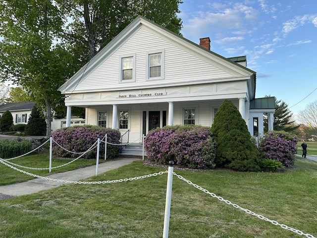 438 Paris Hill Rd, Paris, ME 04281 - neoclassical / greek revival house with a porch, a chimney, and a front lawn