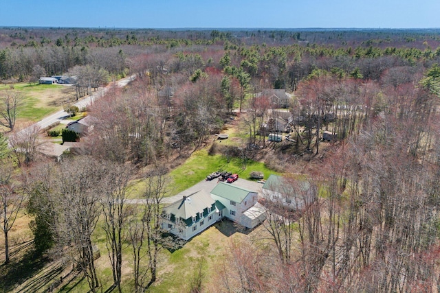 aerial view featuring a wooded view