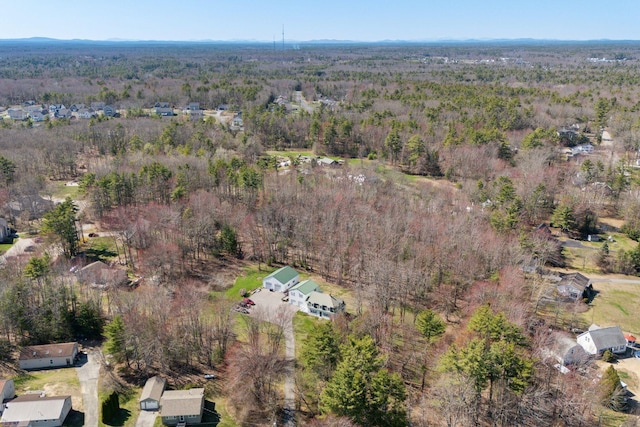 aerial view featuring a wooded view