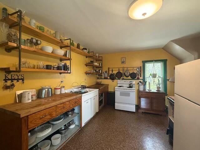 kitchen featuring open shelves, dark speckled floor, white appliances, butcher block countertops, and a sink