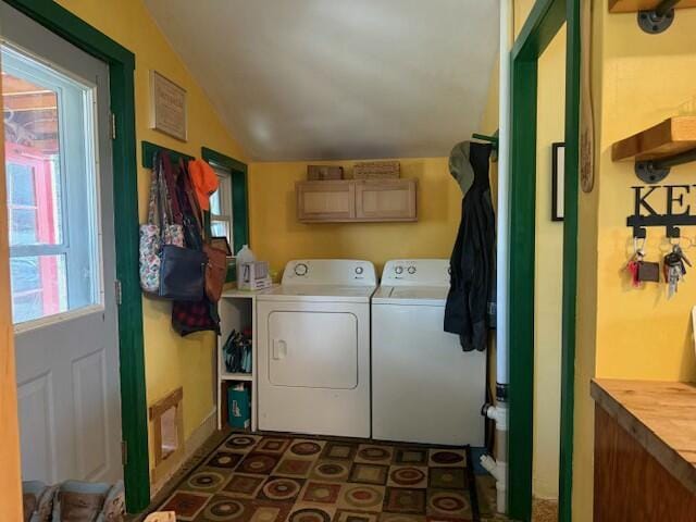 laundry area with cabinet space and independent washer and dryer