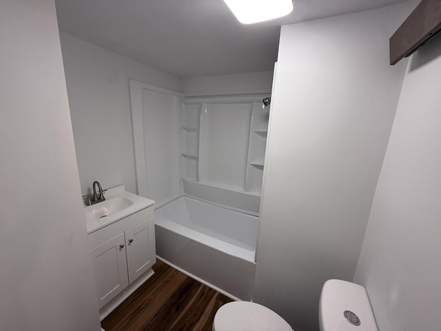 94 Dexter Rd, Corinna, ME 04928 - full bath featuring toilet, tub / shower combination, wood finished floors, and vanity