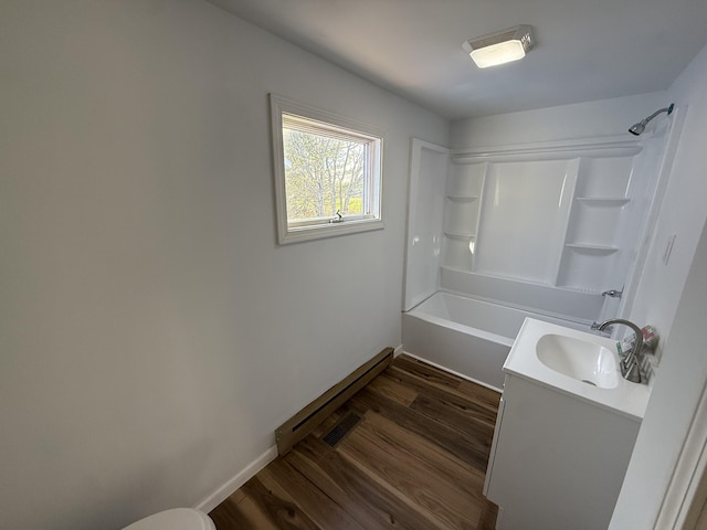 94 Dexter Rd, Corinna, ME 04928 - full bath featuring baseboards, shower / tub combination, wood finished floors, and vanity