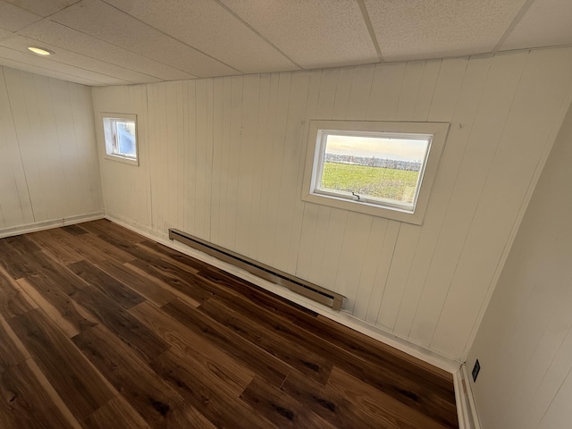 94 Dexter Rd, Corinna, ME 04928 - unfurnished room featuring a baseboard radiator and dark wood-style flooring