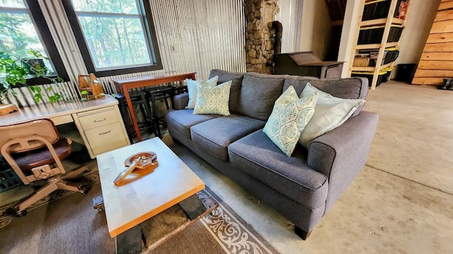 living area featuring concrete floors
