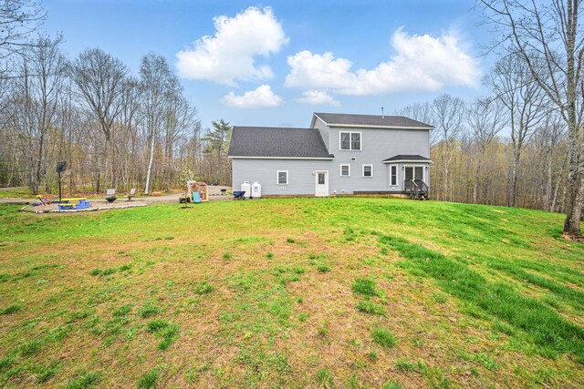 66 Balsam Dr, Windsor, ME 04363 - rear view of house featuring a yard