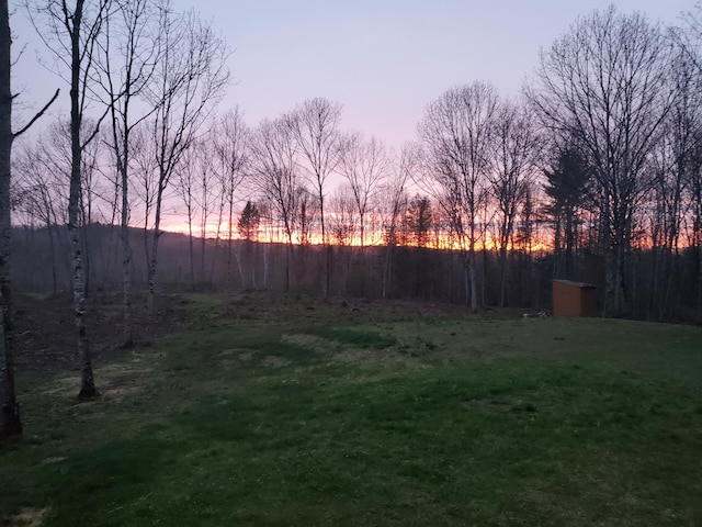 66 Balsam Dr, Windsor, ME 04363 - view of grassy yard with an outbuilding and a storage shed