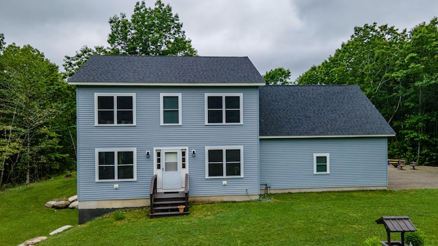 66 Balsam Dr, Windsor, ME 04363 - back of property with a yard, entry steps, and a shingled roof