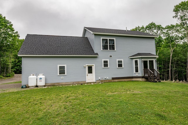 66 Balsam Dr, Windsor, ME 04363 - rear view of property with a lawn and roof with shingles