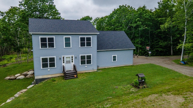 66 Balsam Dr, Windsor, ME 04363 - view of front facade with a front lawn and a shingled roof