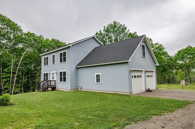 66 Balsam Dr, Windsor, ME 04363 - view of side of property featuring roof with shingles, driveway, a garage, and a yard