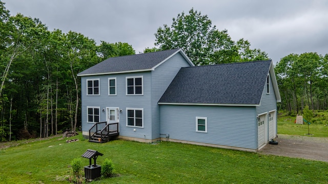 66 Balsam Dr, Windsor, ME 04363 - back of property with roof with shingles, asphalt driveway, a garage, and a lawn