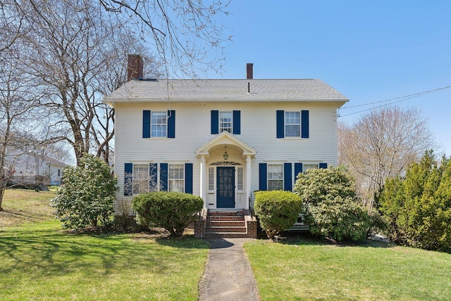 382 College St, Lewiston, ME 04240 - colonial-style house featuring a chimney and a front lawn
