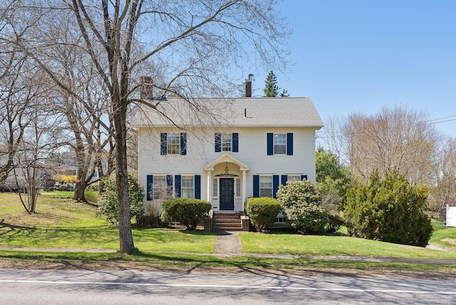 382 College St, Lewiston, ME 04240 - colonial-style house with a front lawn and a chimney