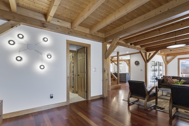 living room with stairs, beamed ceiling, wood finished floors, baseboards, and wood ceiling