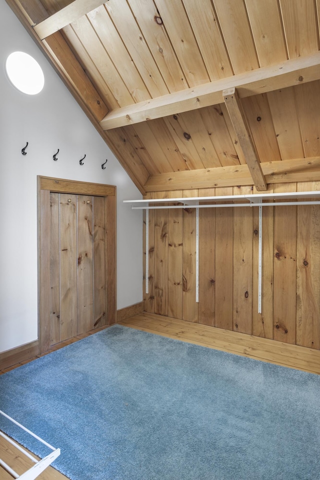 bonus room featuring carpet flooring and wooden ceiling