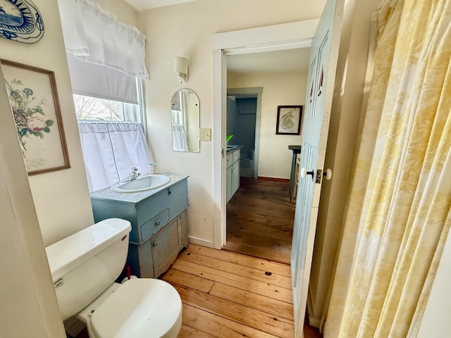7 Mountain St, Vinalhaven, ME 04863 - bathroom featuring hardwood / wood-style floors, vanity, and baseboards