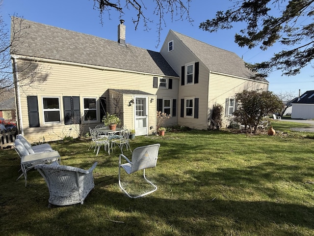 7 Mountain St, Vinalhaven, ME 04863 - rear view of house featuring a chimney and a lawn