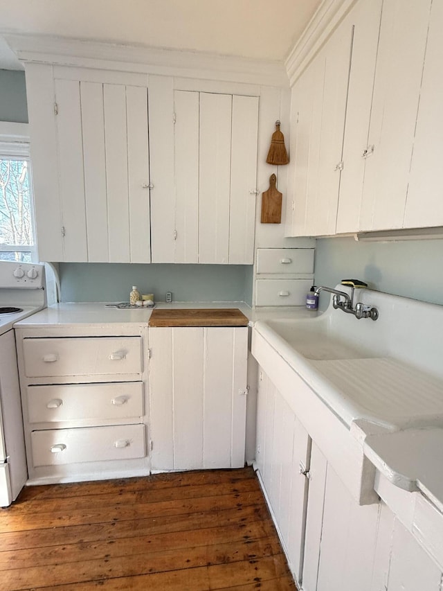 7 Mountain St, Vinalhaven, ME 04863 - kitchen with range, dark wood-style flooring, and white cabinetry