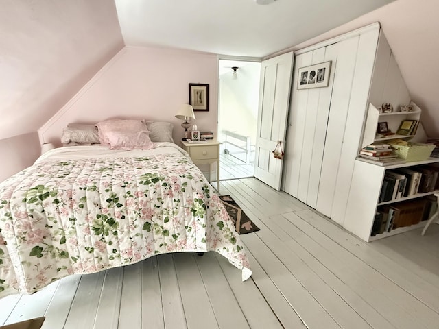 7 Mountain St, Vinalhaven, ME 04863 - bedroom with light wood-style floors and vaulted ceiling