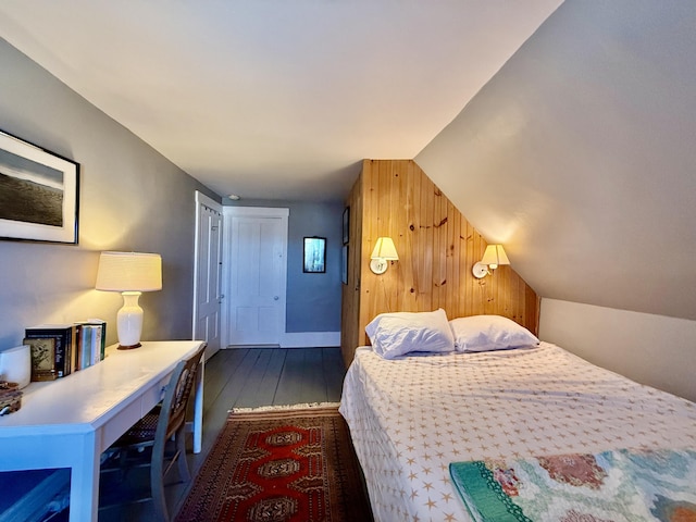 7 Mountain St, Vinalhaven, ME 04863 - bedroom with wood walls, dark wood finished floors, and vaulted ceiling