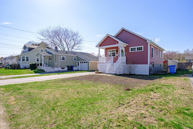 view of front of house featuring a garage, driveway, and a front yard