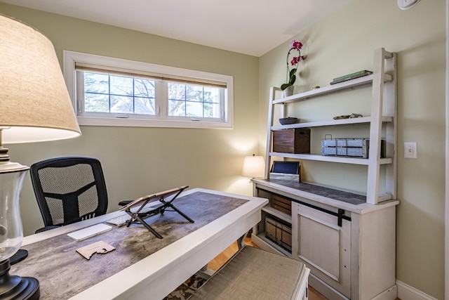 office featuring baseboards and a wealth of natural light