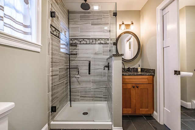 full bathroom featuring a shower stall, tile patterned flooring, and vanity
