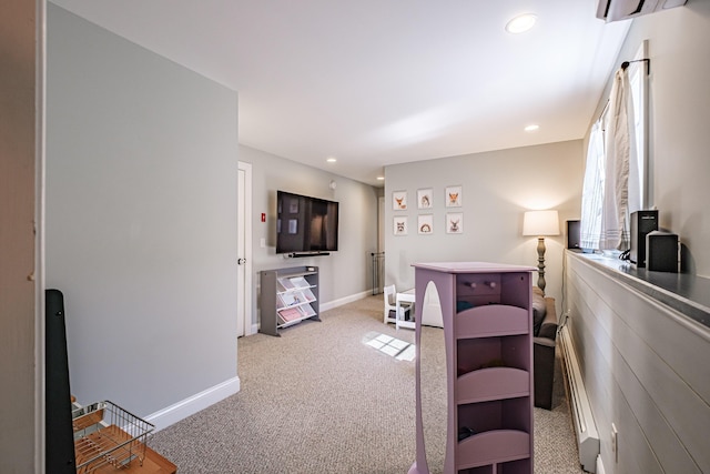 interior space with radiator, baseboards, and recessed lighting
